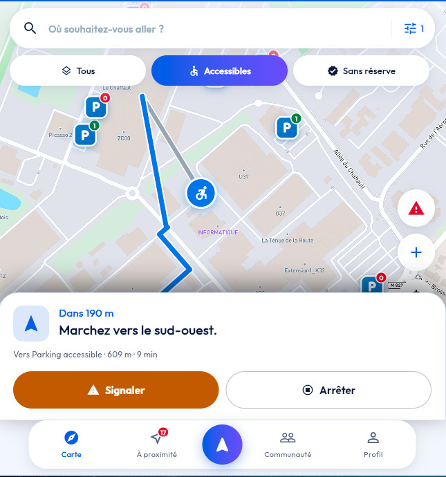 Guidage en cours vers un parking accessible : tracé bleu sur la carte, position de l'utilisateur marquée d'un pictogramme fauteuil roulant, consigne « Dans 190 m, marchez vers le sud-ouest », trajet de 609 m pour 9 minutes, et boutons Signaler et Arrêter.